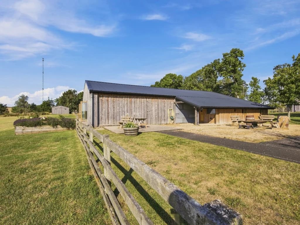 Rural Big Barn setting with outdoor seating and surrounding grounds