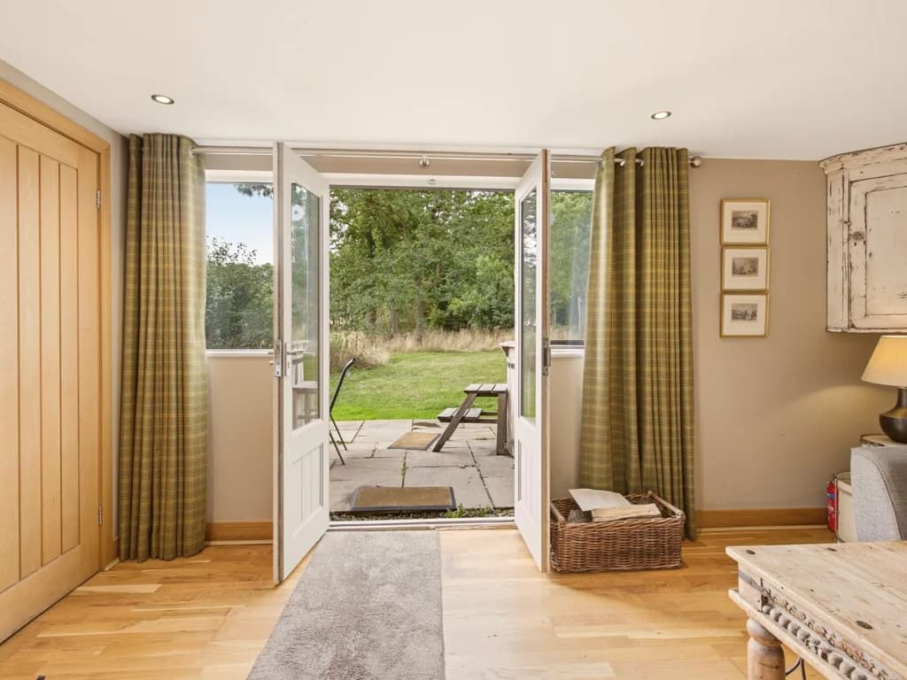 French doors opening directly from the living area to the grounds