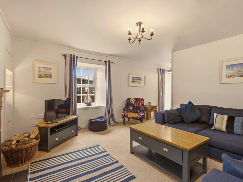 Comfortable lounge with open fireplace, Smart TV and generous corner sofa