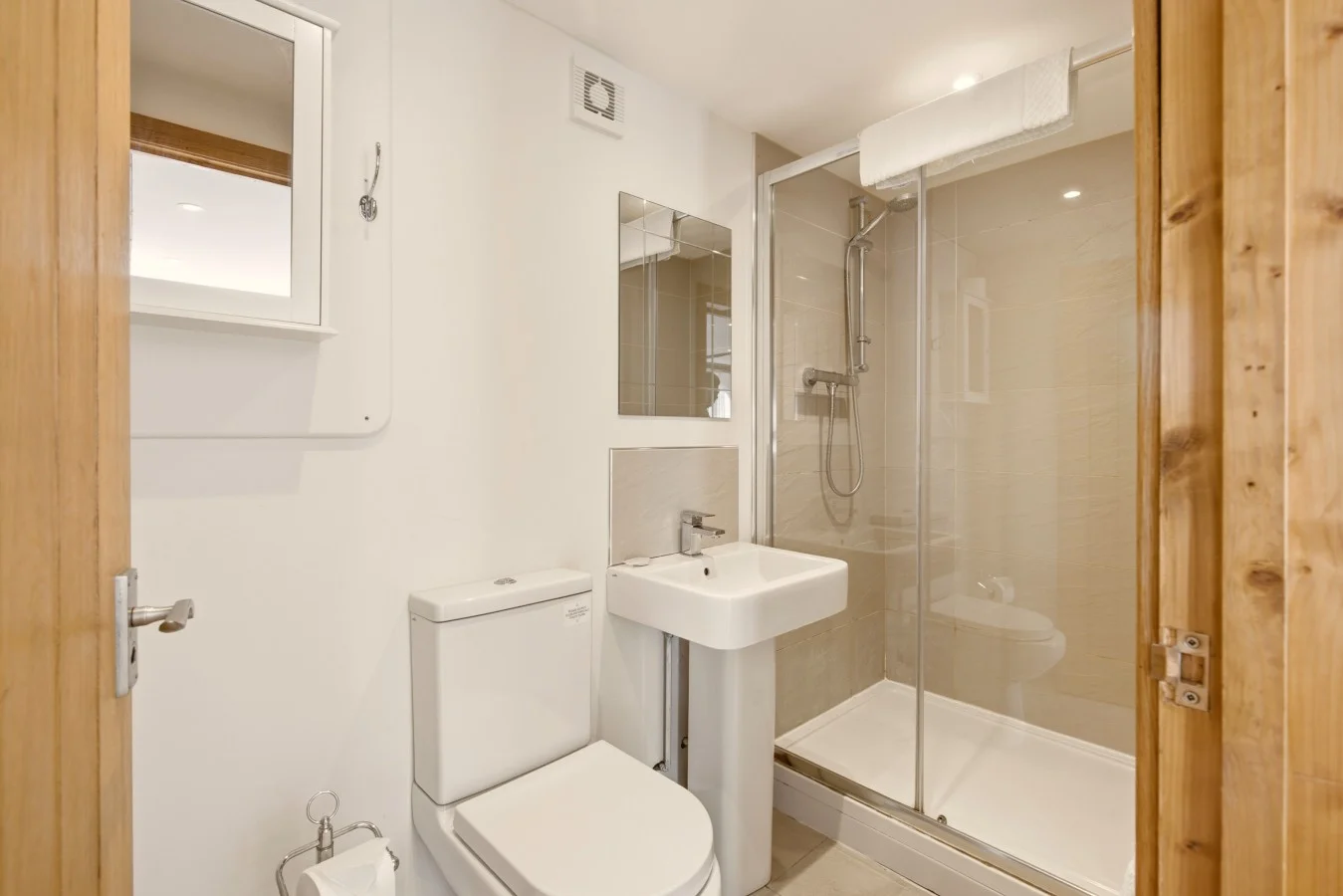 Shower room with glass enclosure, wash basin and WC