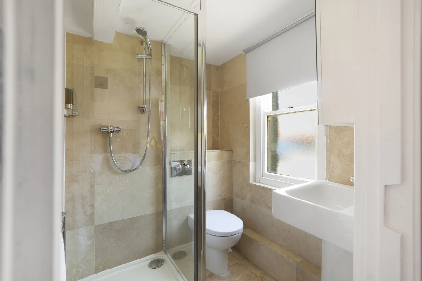 En-suite shower room with walk-in shower and washbasin