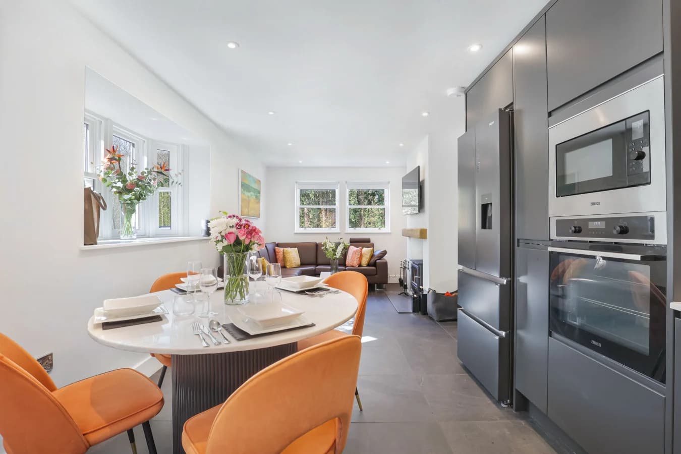Open-plan kitchen and dining area with quartz table