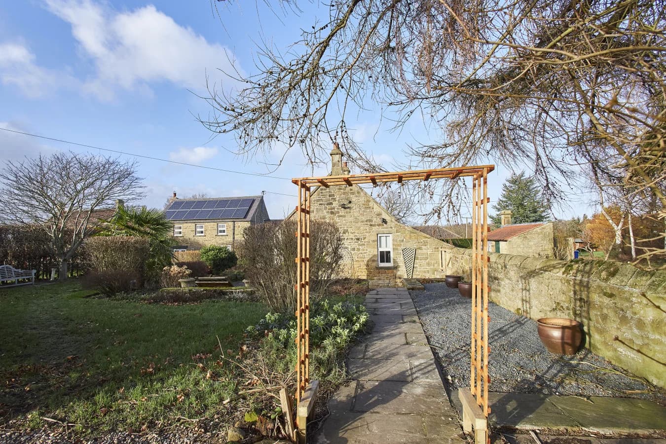 Garden archway framing views back towards The Orchard farmhouse