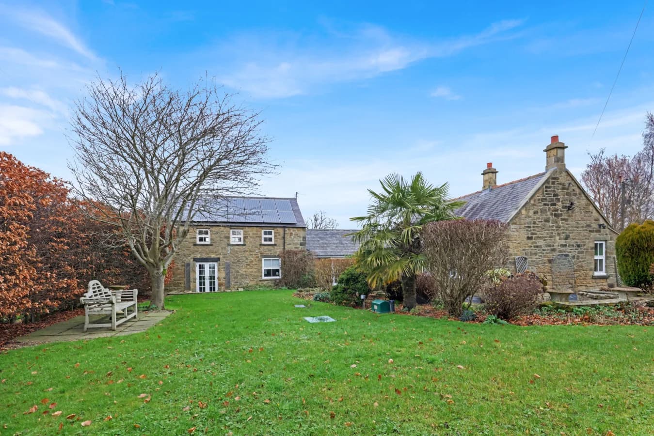 Generous lawn and gardens surrounding this beautifully restored farmhouse