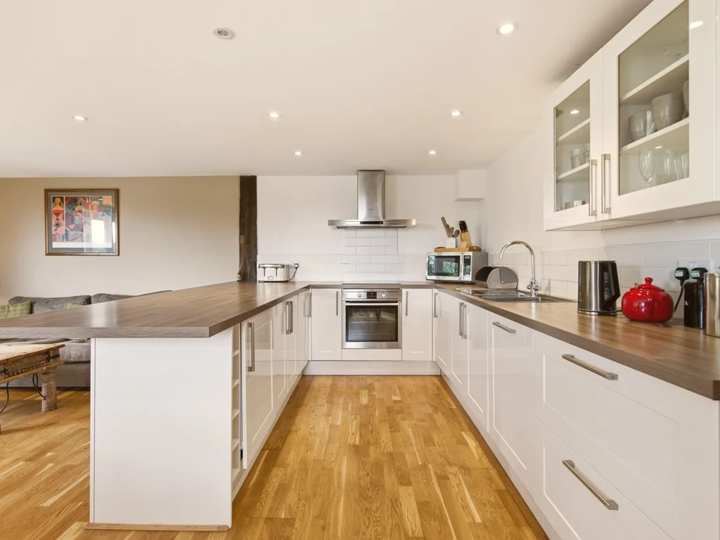 Fully equipped kitchen with extensive worktops and modern appliances