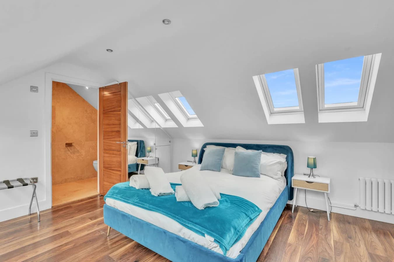 Stylish super-king bedroom with skylights and ensuite access