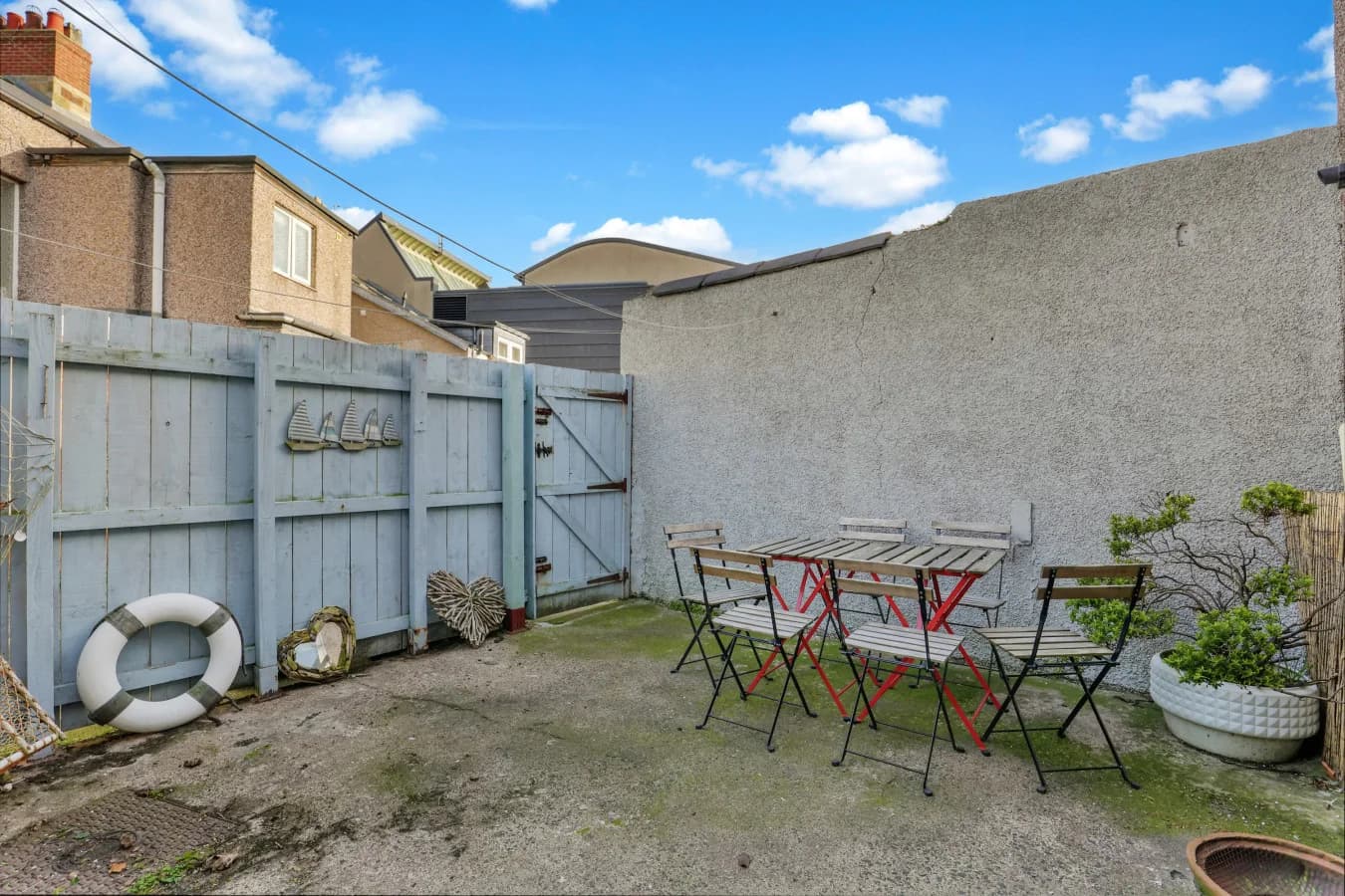Enclosed patio courtyard with outdoor seating for al fresco dining