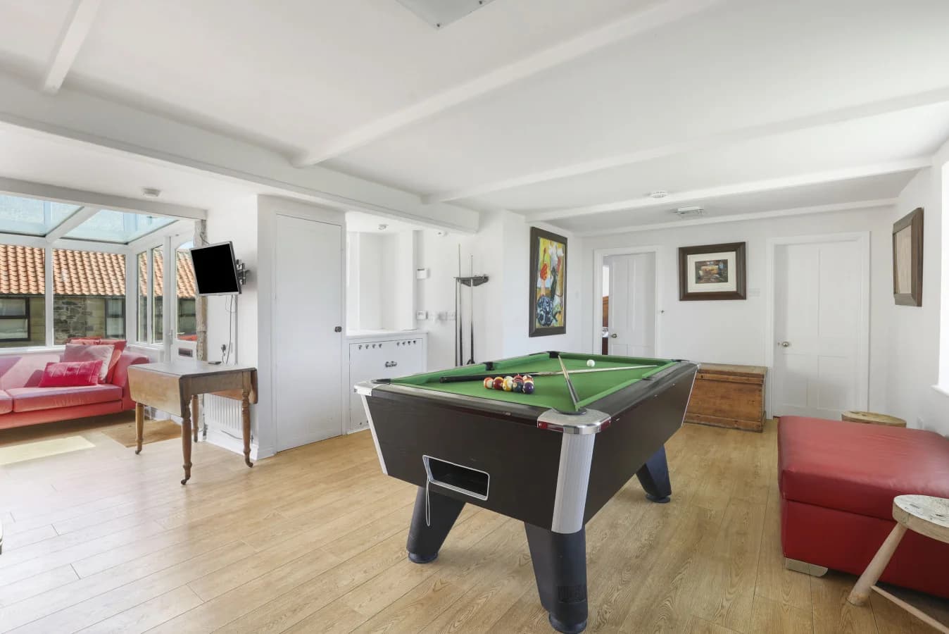 Games room with pool table, TV and oak flooring