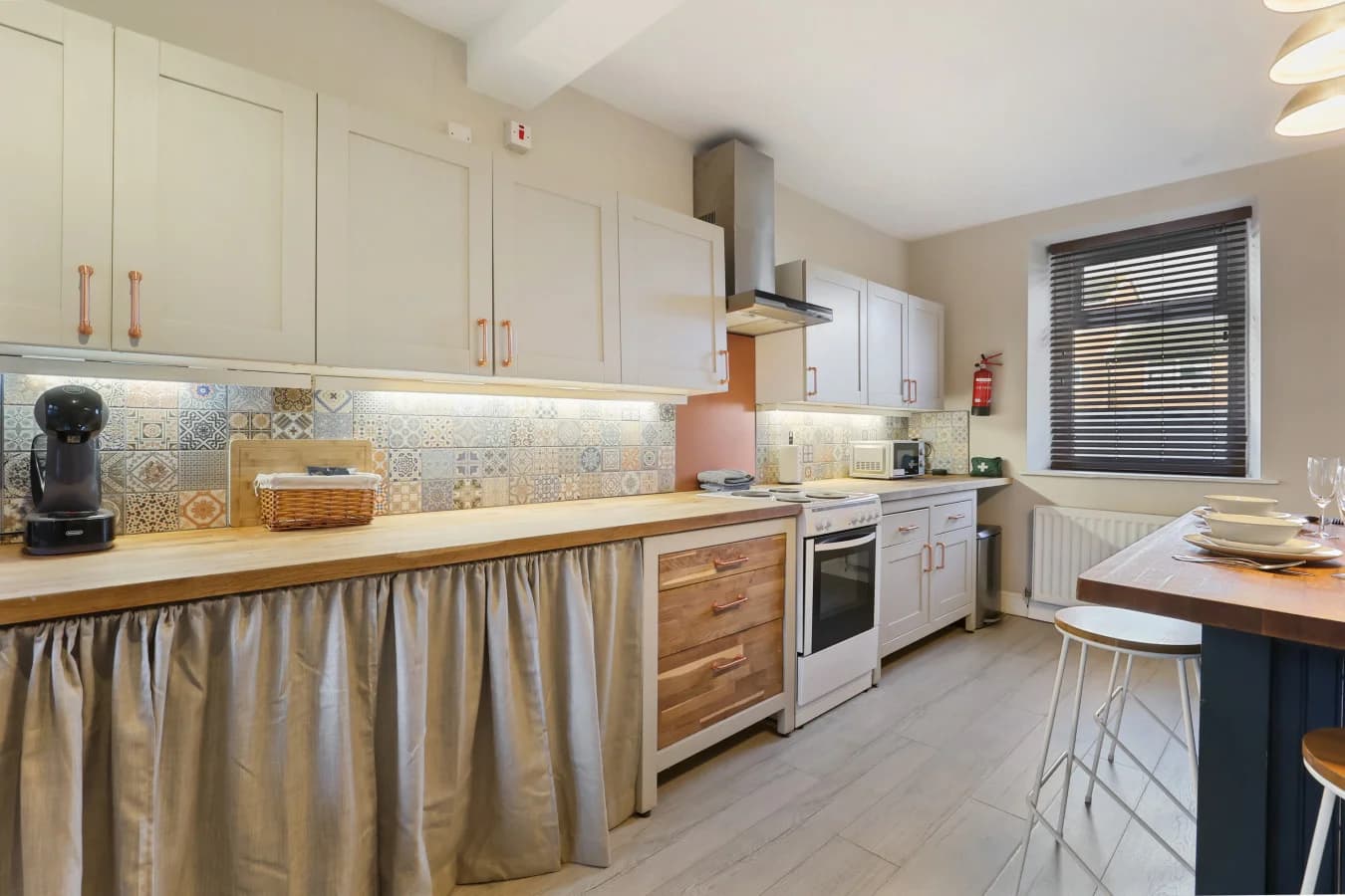 Bright kitchen diner with ample workspace and sociable seating
