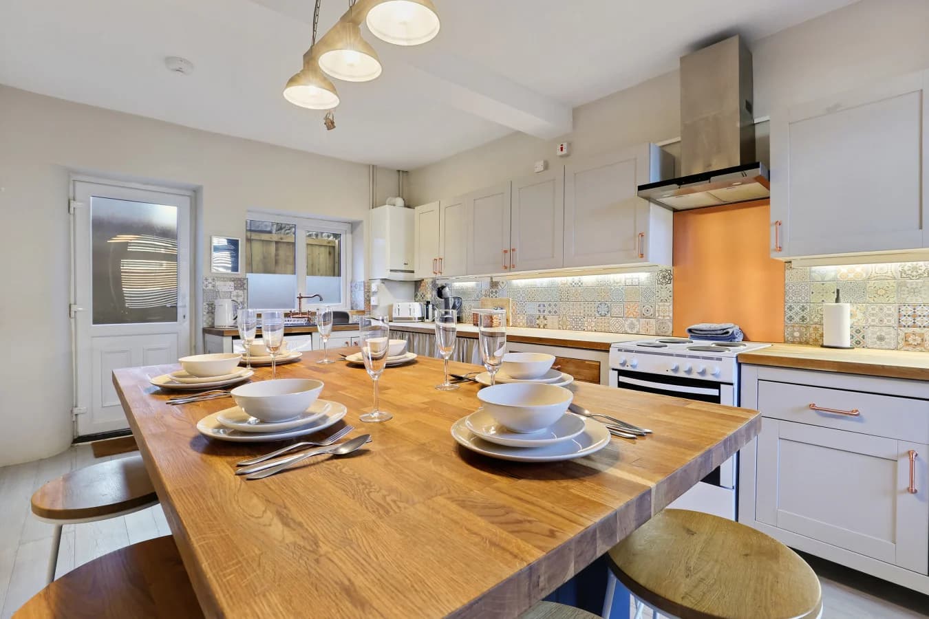 Breakfast bar set for dining in the heart of the open-plan kitchen
