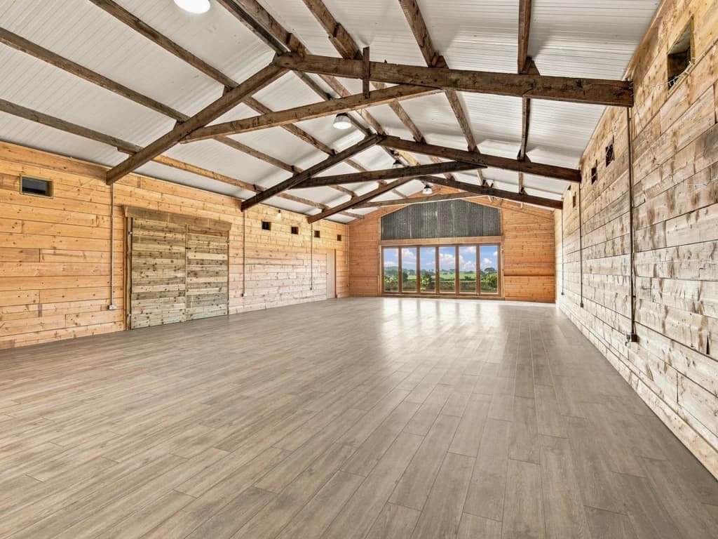 Rustic timber event barn with open floor space for group activities