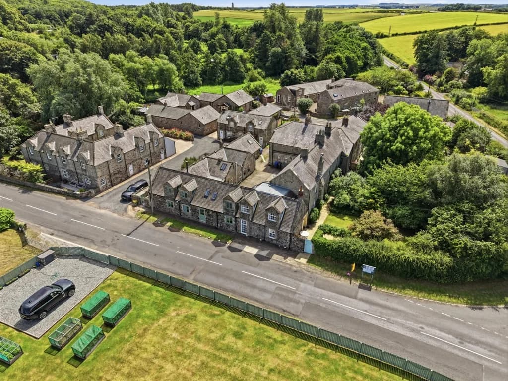 Elevated view of the peaceful stone cottages nestled in the heart of Waren Mill