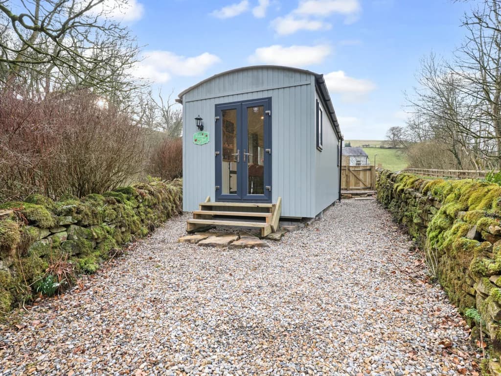 Stylish shepherd’s hut in a tranquil rural setting.