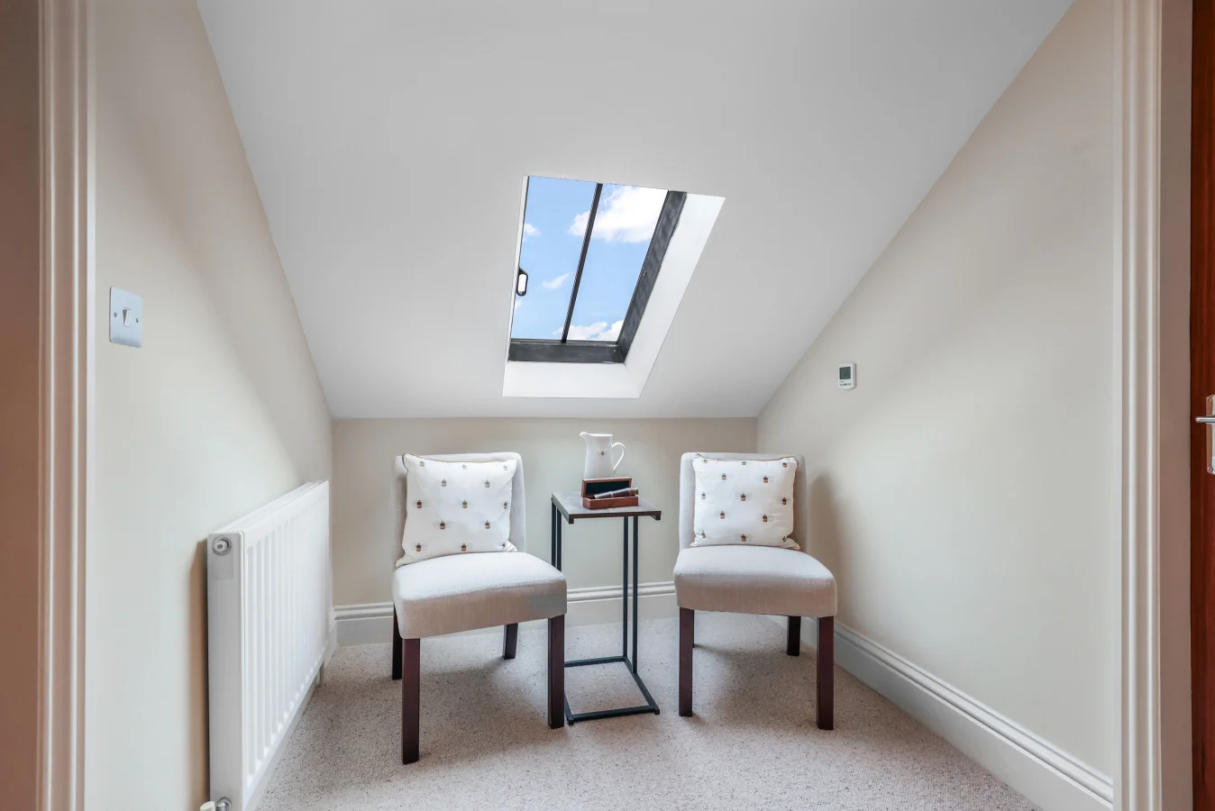Quiet landing seating area beneath a skylight window