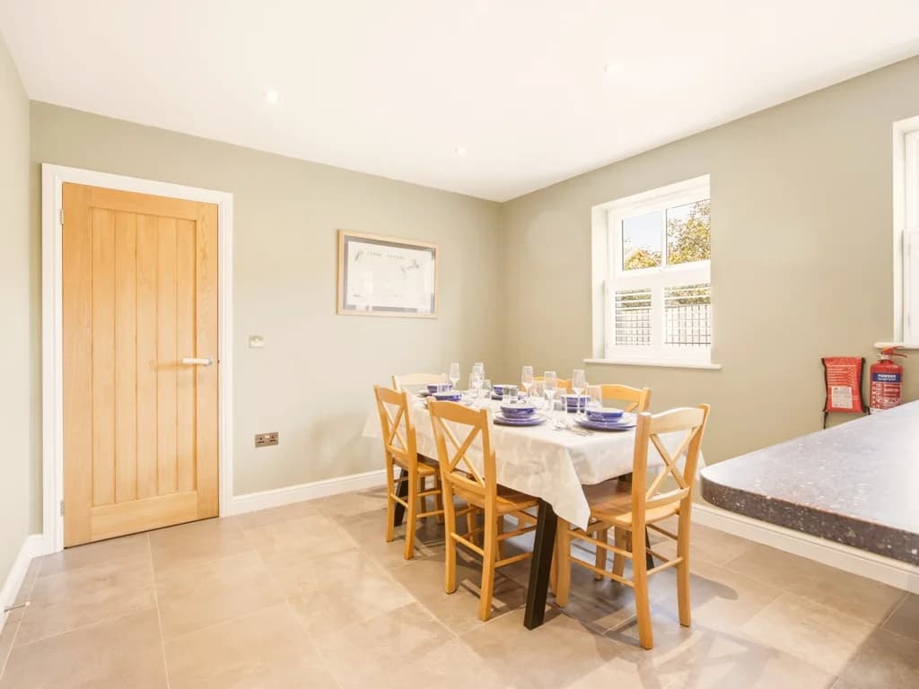 Dining area with table for six and generous adjoining worktop space