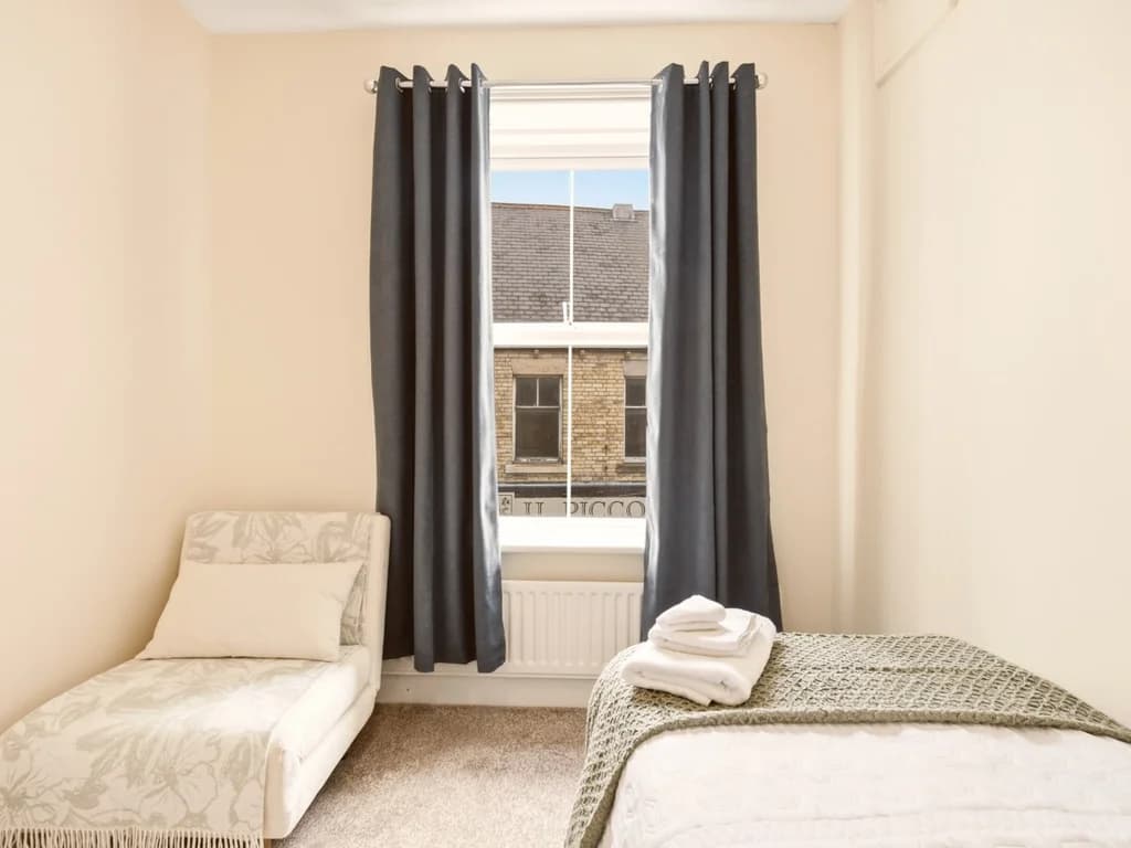 Flexible second bedroom with single bed, futon and village view.