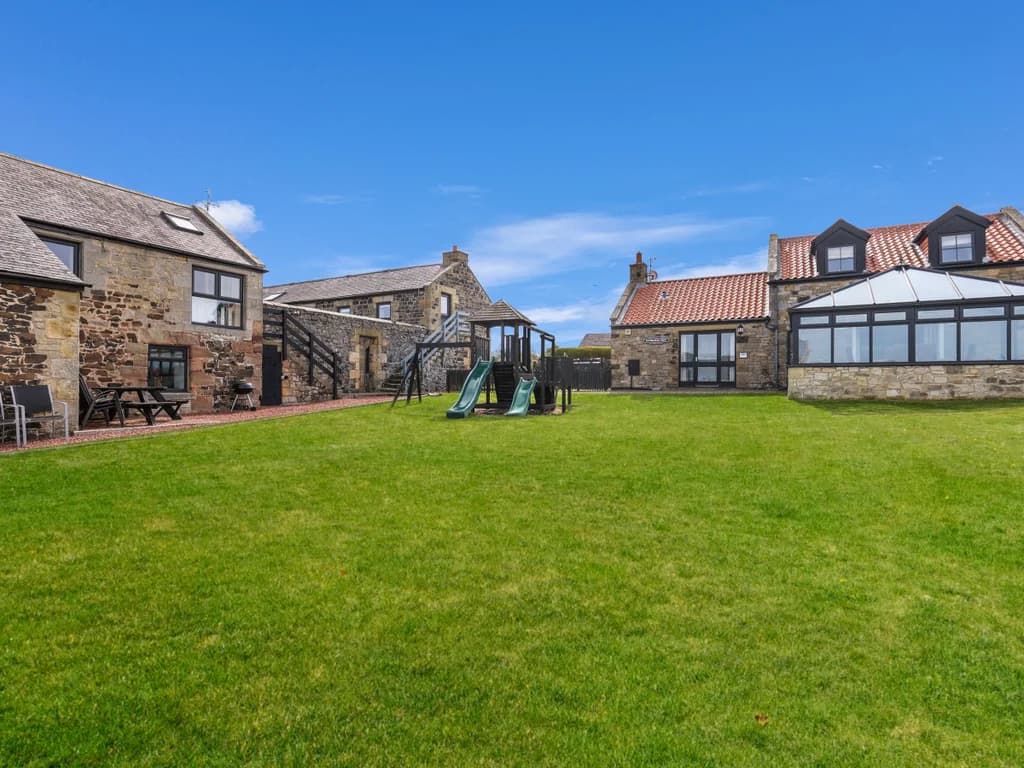 Shared lawn surrounding the exterior of the cottage