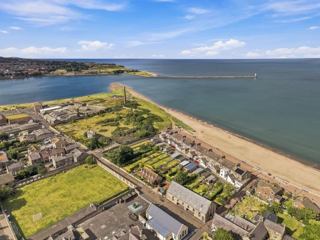 Elevated view of Spittal shoreline, promenade and sandy beach.