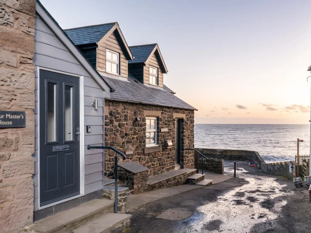 Charming exterior of Harbour Masters House, perfectly positioned just moments from the sea.