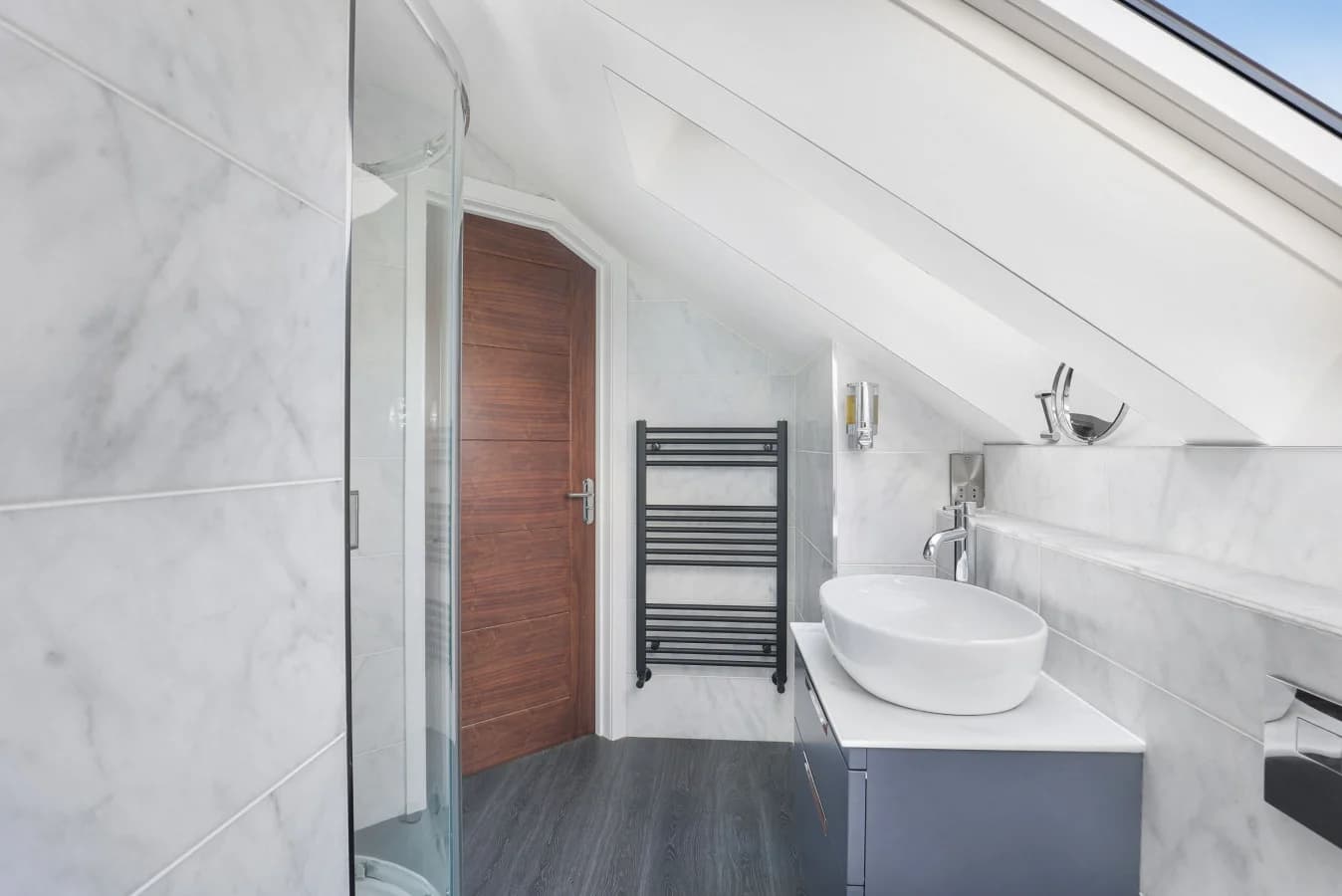 En-suite shower room with vessel basin, skylight and shower enclosure