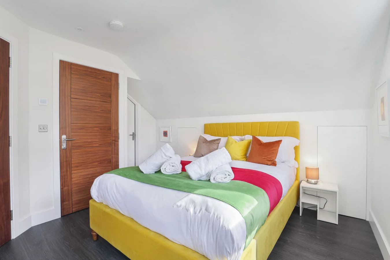 King bedroom with a mini-bedside table and a walk-in wardrobe