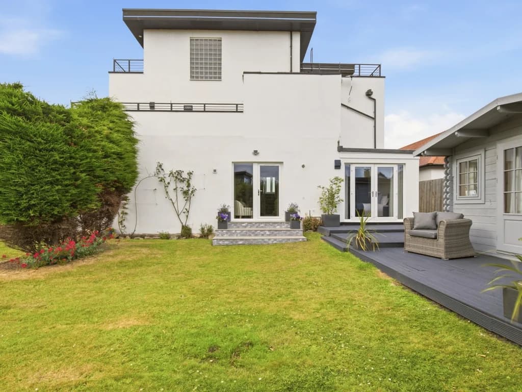 Large private lawn and patio offering space to relax and dine outdoors