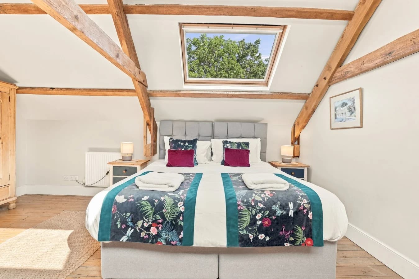 Super king bedroom with skylight and exposed timber beams
