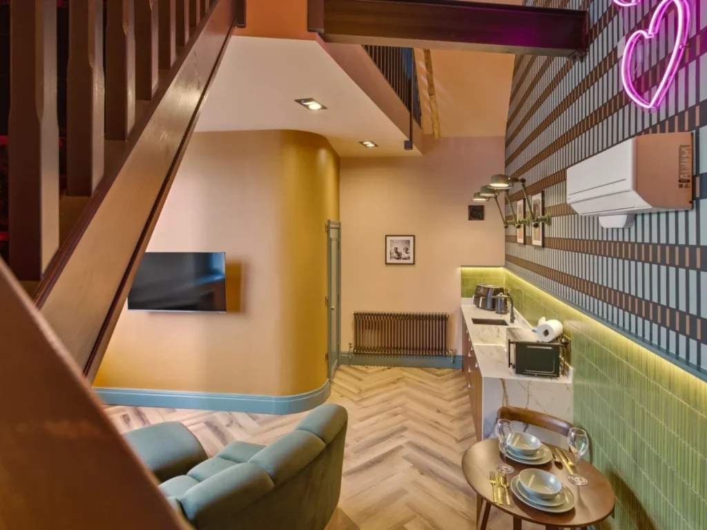 View from the mezzanine over the open-plan living and kitchen area