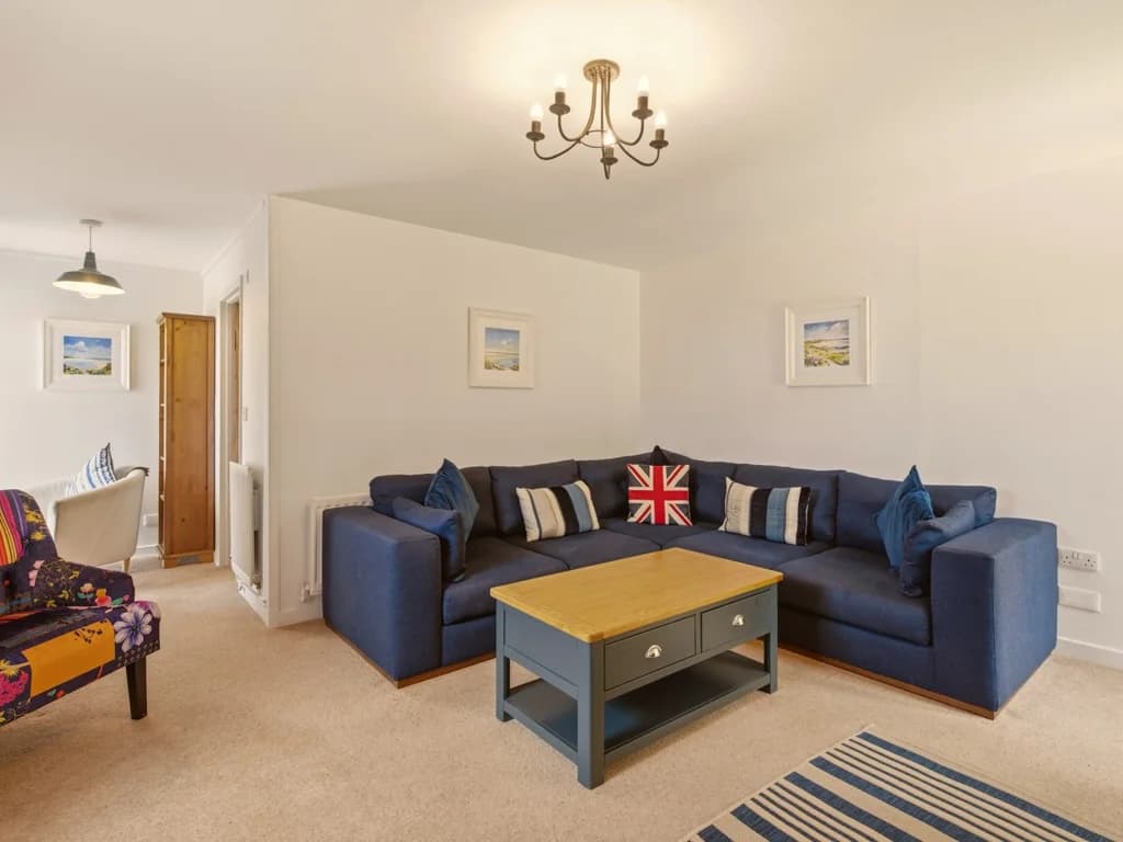 Bright living room with comfortable seating and traditional cottage character