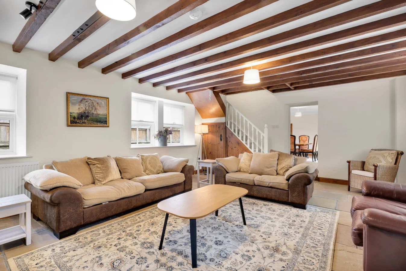 Generous sitting room flowing through to the dining area beyond