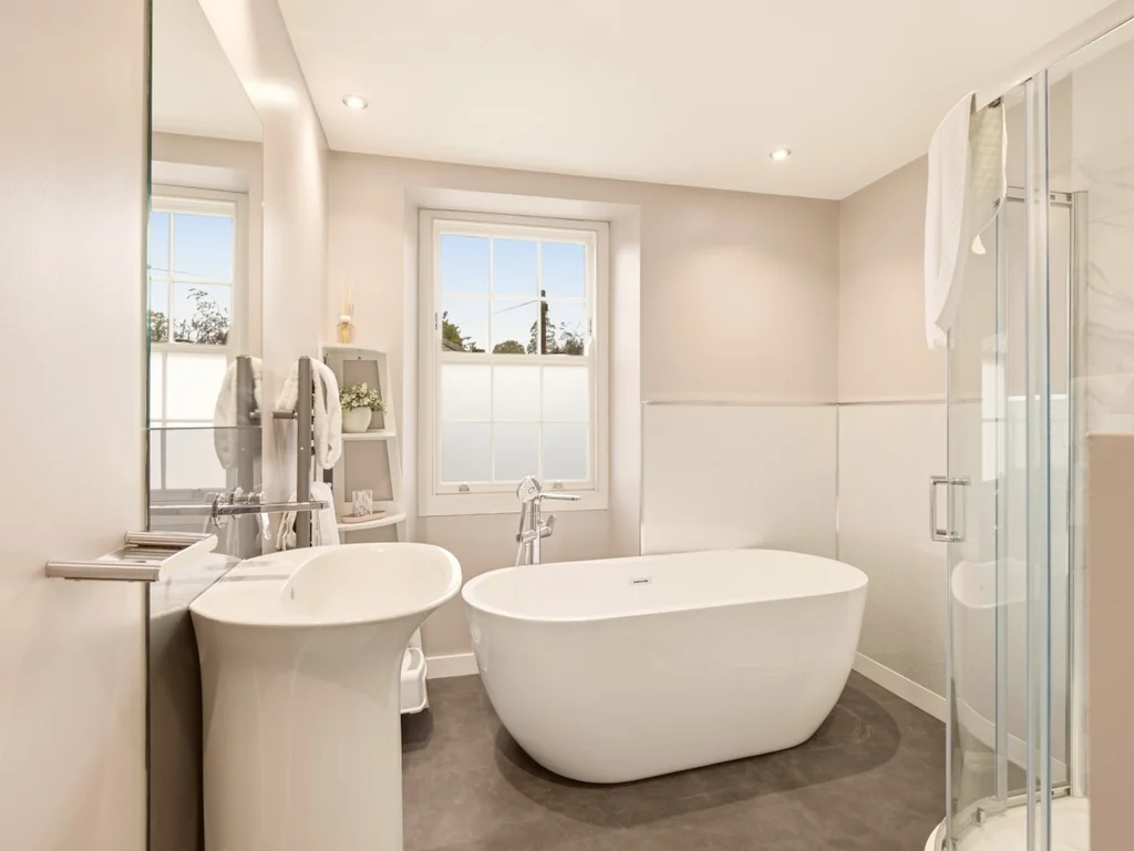 Spacious family bathroom with freestanding bath and separate shower.