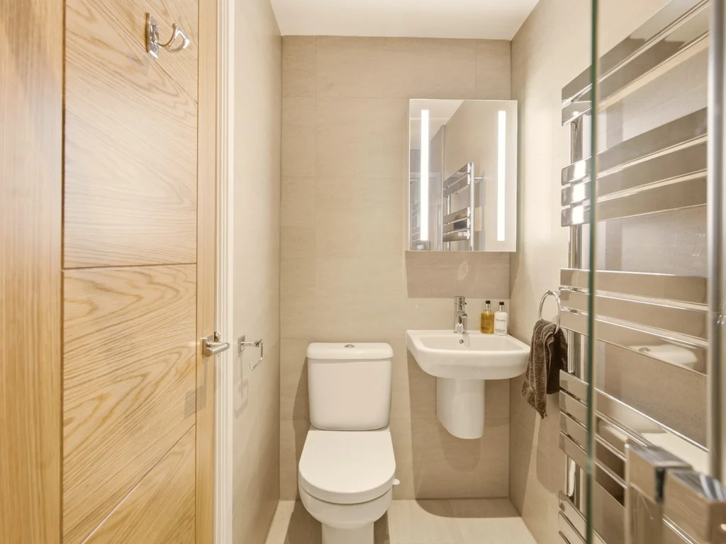 odern en-suite bathroom with shower, heated towel rail and WC