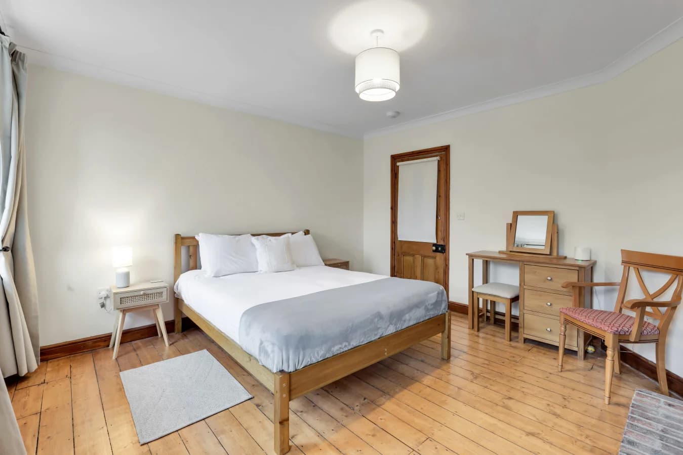 Light and airy bedroom with original floorboards and oak furnishings
