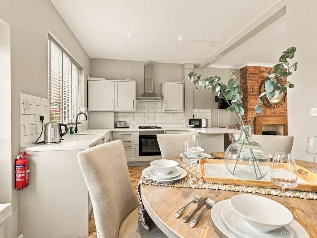 Open-plan dining area with breakfast bar overlooking the kitchen.