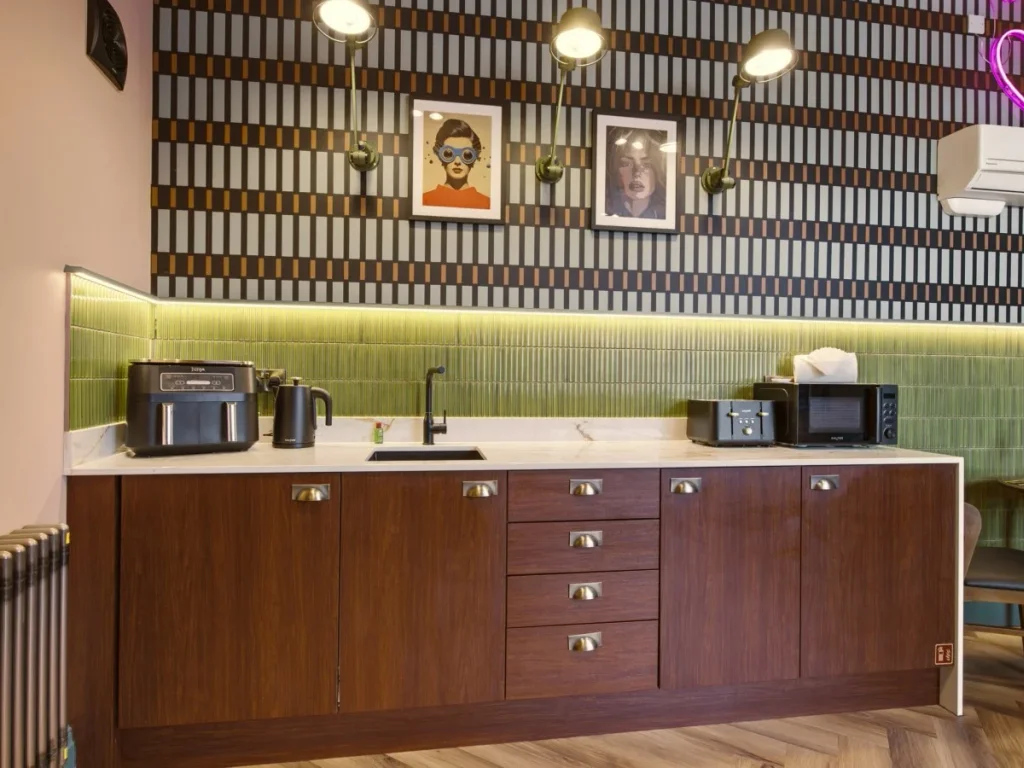 Compact kitchenette with air fryer, kettle, microwave and mini fridge