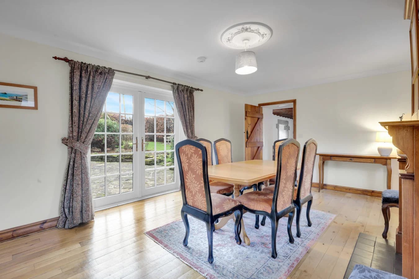 French doors opening onto views of the garden and orchard