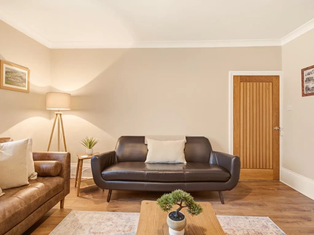 Inviting lounge with leather seating and cosy living space.