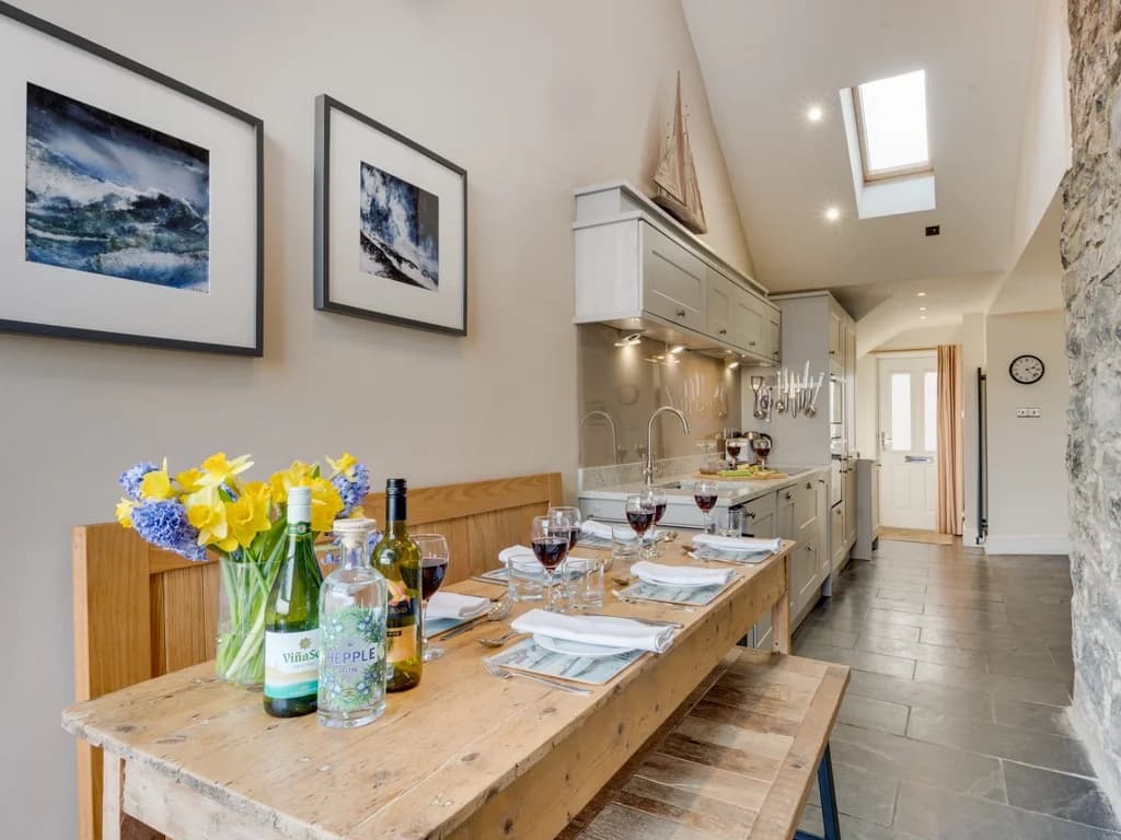 Welcoming dining space beside the fully equipped kitchen, perfect for relaxed meals together.