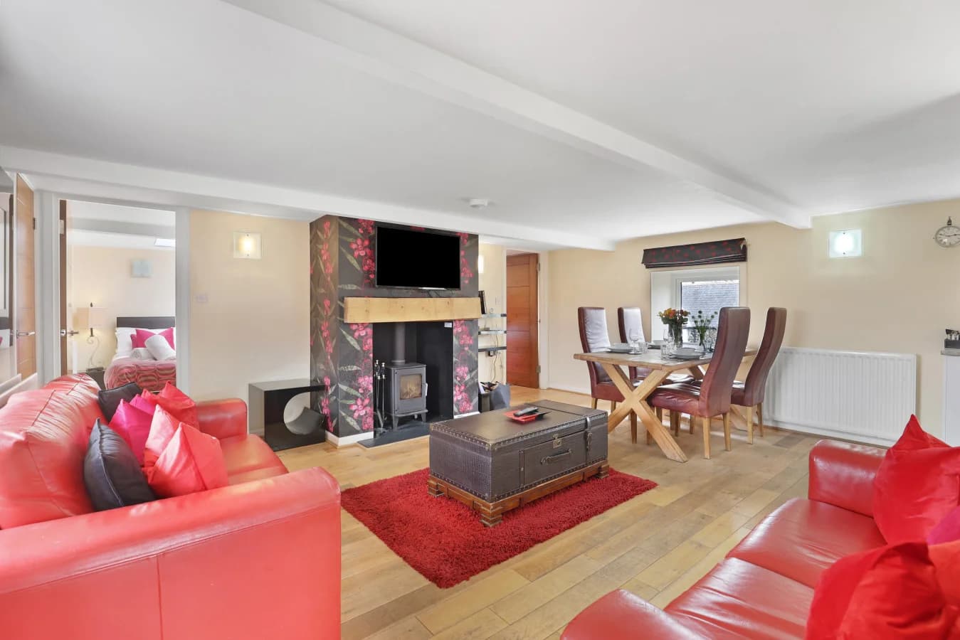 Living area with log burner and dining table