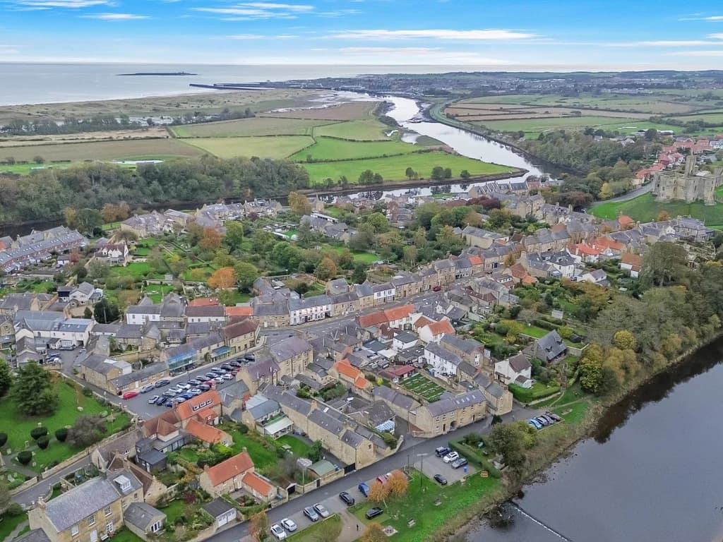 Aerial view of historic Warkworth, the River Coquet and the beautiful Northumberland coastline.