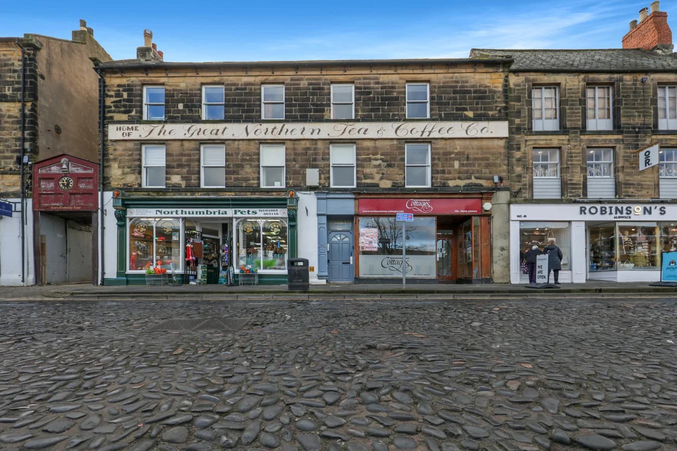 The historic Tea Warehouse frontage overlooking Alnwick's cobbled marketplace