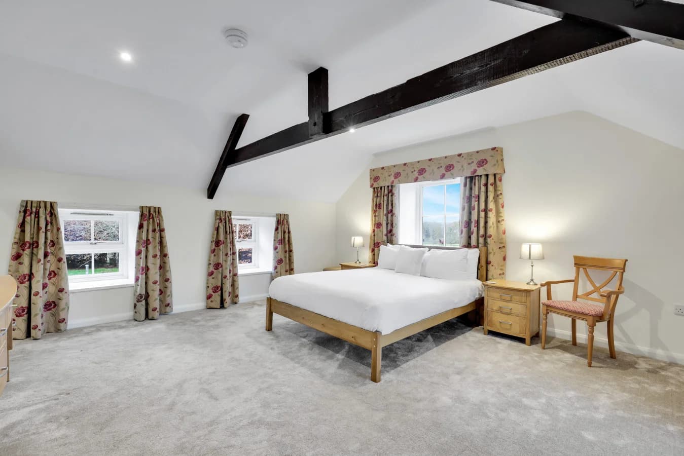 First-floor retreat with soft carpeting and countryside views