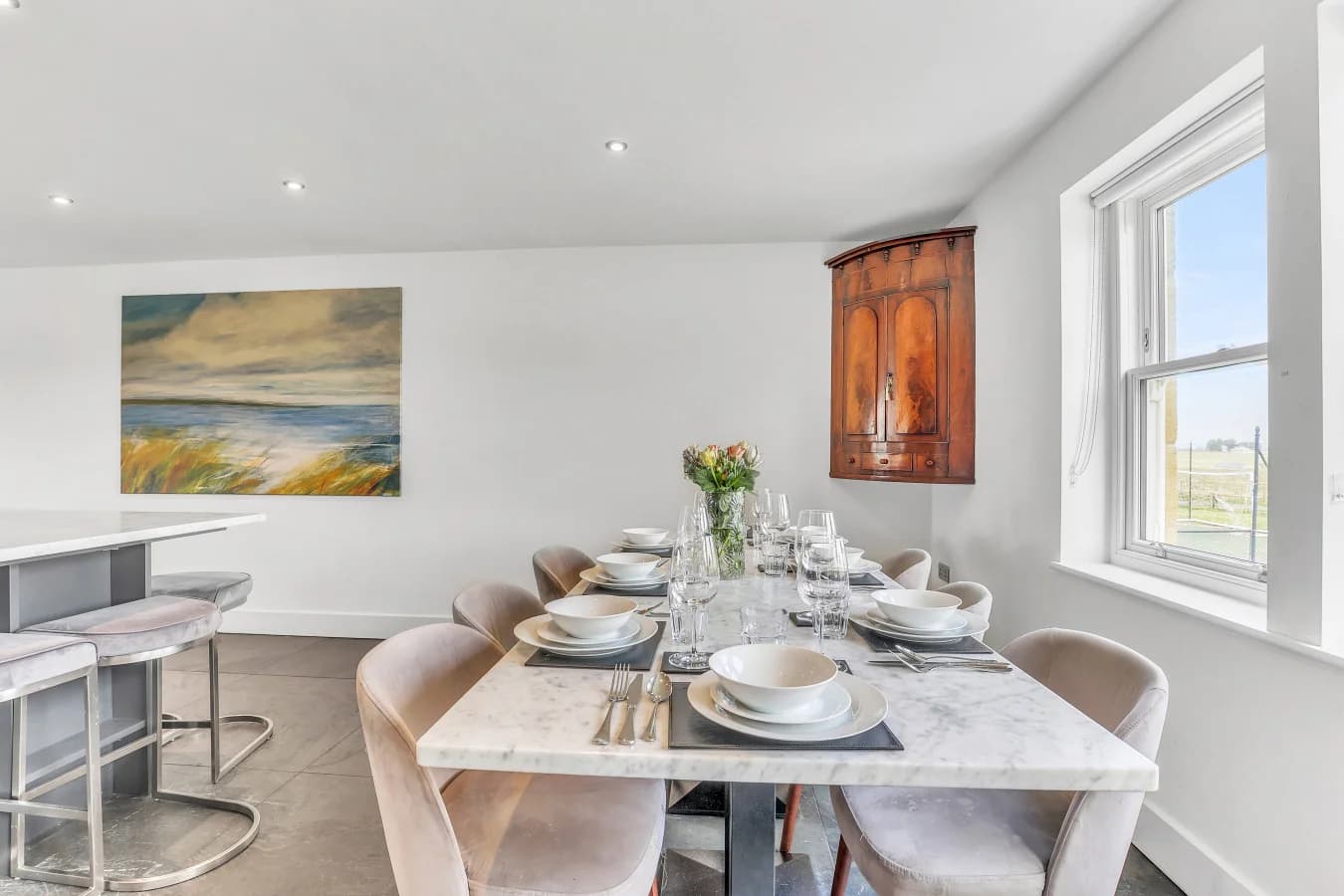 Marble dining table with seating for eight and countryside views