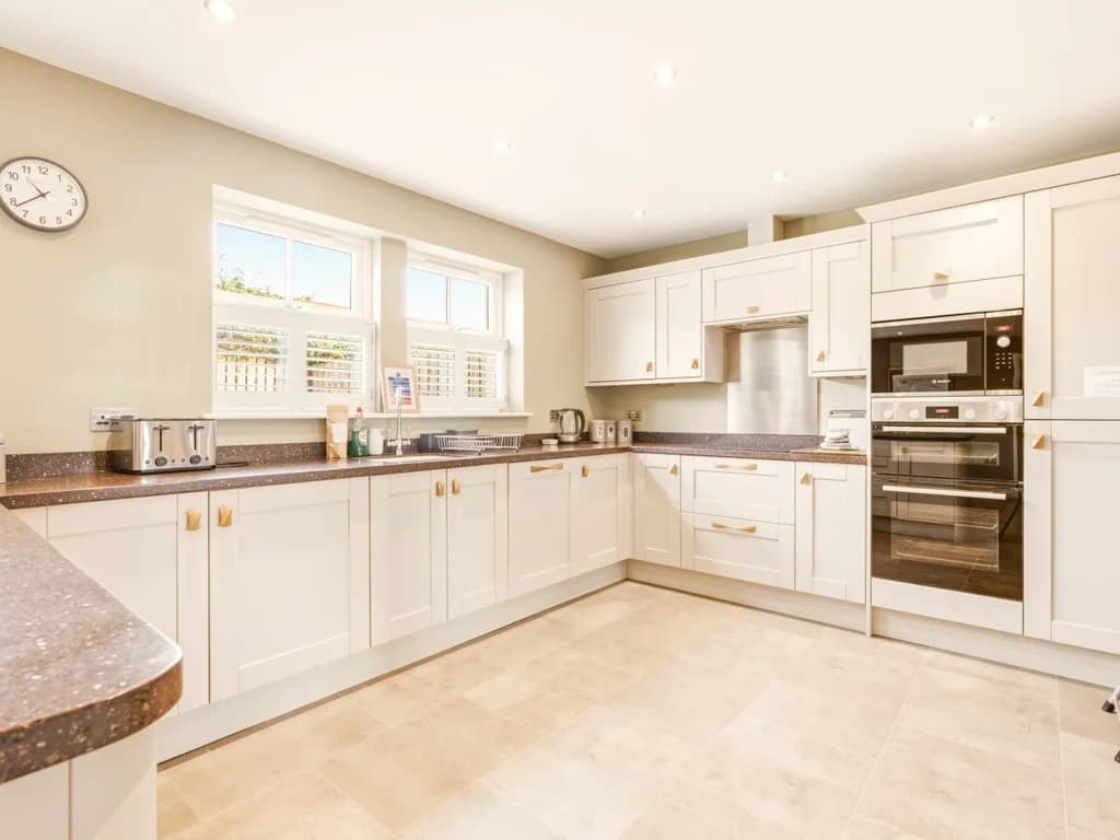 Fully equipped kitchen with integrated appliances and ample storage