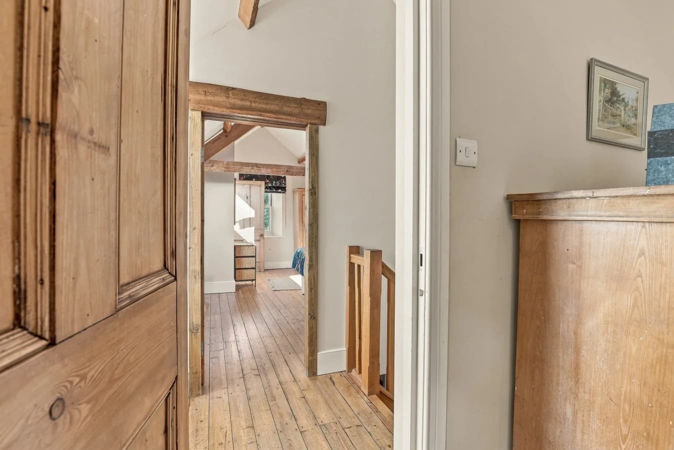 Upper-floor landing with original wooden doors and timber details