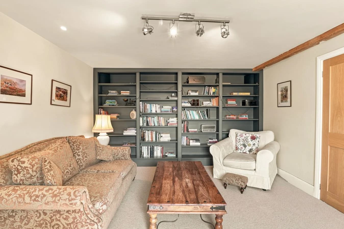 Bookshelf detail with books and decorative concertina