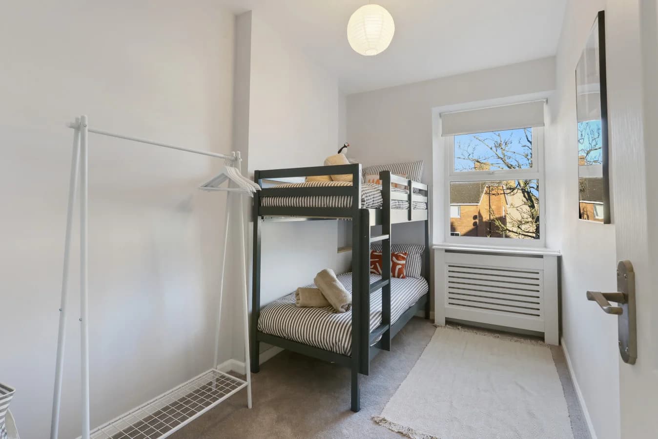 Bunk bedroom with painted timber bunks and views across Amble