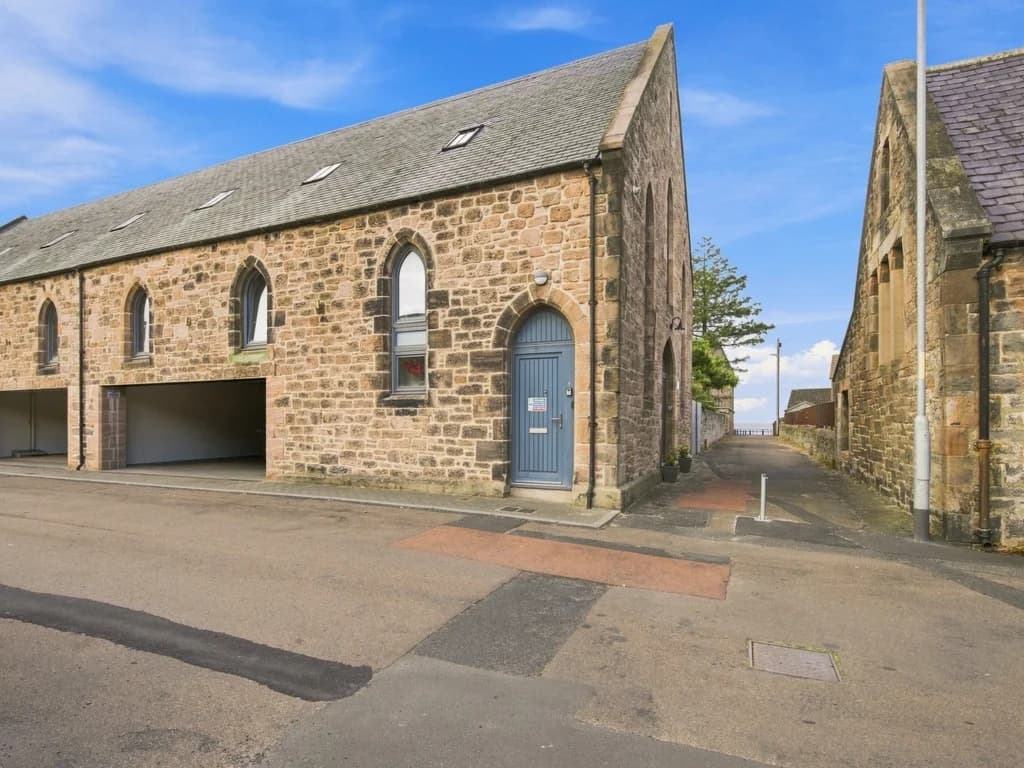 Exterior of Old Templars Hall with distinctive stone architecture.