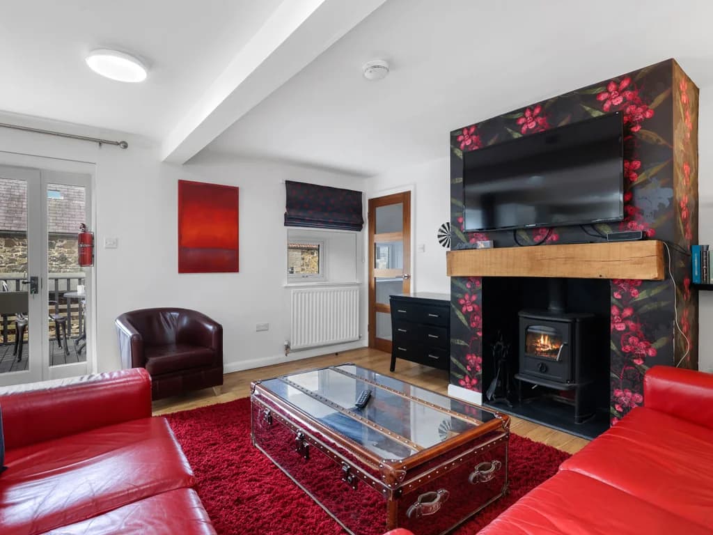 Lounge with floral feature fireplace and Smart TV