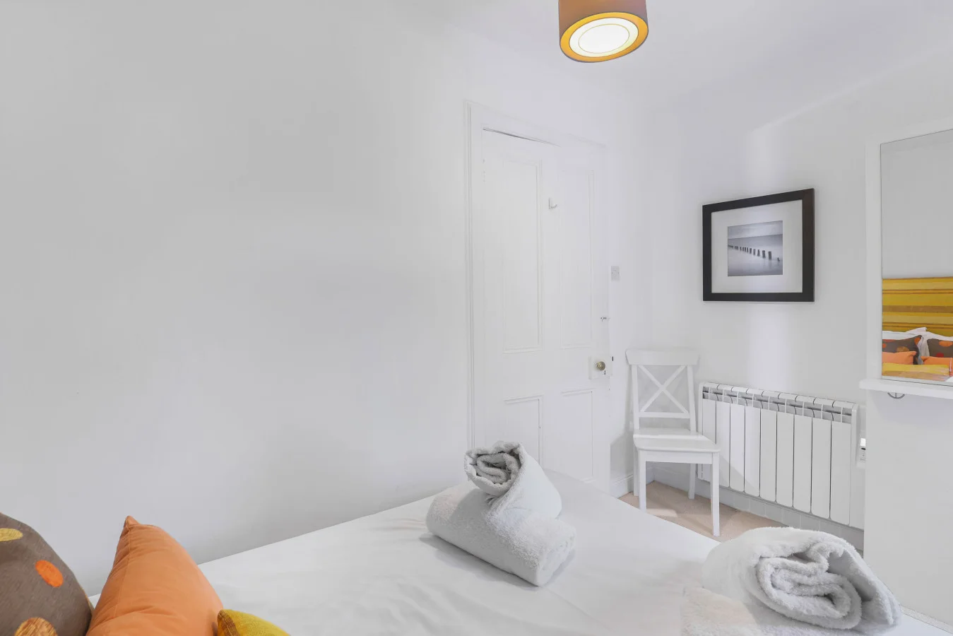 Cozy bedroom with a double bed and vanity area